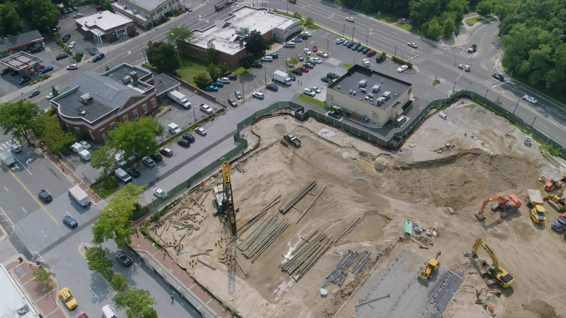 aerial-view-of-construction-site-in-a-small-town-2023-11-27-04-58-08-utc